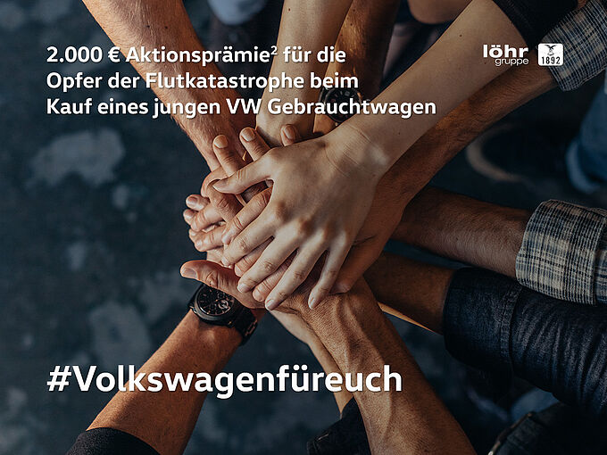 Top view of creative professionals putting their hands together as a symbol of teamwork, cooperation and unity. Stack of hands of men and woman.